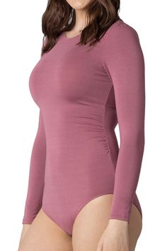 Slick and seamless. This long-sleeve crew-neck bodysuit has a buttery, second-skin-like feel, and a knitted-in, draping effect on the waistline that hugs and shapes. Product Features: Crew Neckline Full Cut Bottom Snap Closure Gusset for Ease Knitted-in Waistline That Shapes Model is 5'10 and wearing size Medium Materials and Care: 97% Modal / 3% Spandex Machine-Wash Cold Gentle Imported For hygiene purposes, all bodysuits are final sale. Mauve Color, Black Bodysuit, Second Skin, Crew Neckline, Snap Closure, Product Features, Final Sale, Size Medium, Spandex