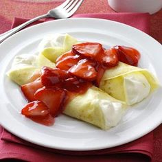 strawberries and banana slices on a plate with ketchup