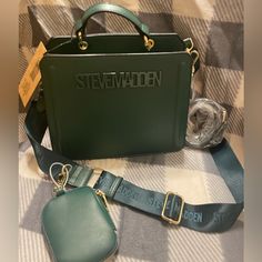 Nwt Authentic Steve Madden Bevelyn Crossbody Bag **Viral On Tik Tok** -Color:Cedar Green -Dimensions: 9"W X 8"H X 4.25"D -Single Top Handle -Faux Leather -Gold Hardware -Detachable Nylon Straps -Included Accessory: Airpod/ Coin Pouch The Green And Gold Look Of This Bevelyn Satchel Is Absolutely Stunning. Guaranteed To Be New With Tags, 100% Authentic, And From A Smoke And Pet Free Home. Reasonable Offers And Bundles Are Welcome! Let Me Know If You Have Any Questions :) Steve Madden Bevelyn, Brand Purses, Name Brand Handbags, Handbag Brands, Pretty Tote Bags, Luxury Bags Collection, Steve Madden Purse, Brand Handbags, Handbag Essentials