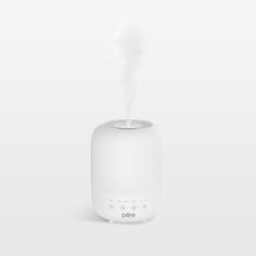 Enjoy the comfort of moisturized air in your home with this modern humidifier. With its top-fill design, the humidifier takes the mess out of refills, and the generous three-liter capacity keeps your home humidified for up to 30 hours. Program the sleek white unit to suit your preferences or use the auto mode to measure the humidity in the air and adjust automatically. Evenly dispersed mist, soft-glow lights in a variety of hues and the aromatherapy option transform any room into a spa-like spac Modern Humidifier, Zen Meditation Room, Dorm Necessities, White Units, Cloud Art, Humidity Sensor, Zen Meditation, Meditation Room, Clean Laundry