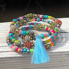 Elevate your style with this stunning four-layer memory wire cuff bracelet, designed to make a bold statement wherever you go. Featuring a captivating combination of Pink blue teal and other beads, it exudes a distinct western boho vibe that effortlessly complements any outfit, whether it's for everyday wear, beach vacations, or special occasions. Crafted with memory wire, this bracelet offers a perfect fit for all wrist sizes, making it an ideal gift for any woman in your life. The innovative design ensures that the bracelet retains its shape, while the coiled layers create a stacked bracelet effect that adds a touch of elegance to your ensemble. Make a chic fashion statement with this versatile accessory that seamlessly blends style and functionality. Bohemian Multicolor Stacked Beaded Bracelets, Multicolor Bohemian Stacked Bracelets, Bohemian Multicolor Stacked Bracelets, Bohemian Stacked Multicolor Jewelry, Wire Cuff Bracelet, Wire Wrap Bracelet, Wire Cuff, Memorial Bracelet, Wire Wrapped Bracelet