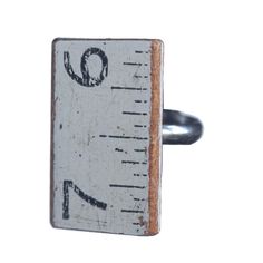 a ruler ring with the word q on it