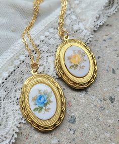 "Victorian Floral Secret message locket,Japanese Vintage cabochon,Antique gold Locket,Personalized Gift Mother Wife,Oval Picture Photo locket ♥ All my items are made to each order, and are made in small series! This feminine vintage style necklace is made of a brass golden locket with a beautiful floral glass cabochon, hung on a golden chain. Choose if you like a Blue or a Yellow rose cabochon. This is new made to look just like the old, vintage jewelry. The adorable floral glass cabochon is \"v Vintage Rose Gold Locket Necklace Gift, Vintage Rose Gold Locket Necklace For Gift, Cameo Locket Necklace As Gift, Cameo Oval Pendant Locket Necklace Gift, Oval Cameo Locket Necklace Gift, Vintage Handmade Necklaces With Oval Cabochon, Vintage Rose Gold Oval Locket Necklace, Vintage Handmade Oval Cabochon Necklaces, Vintage Handmade Oval Cabochon Necklace