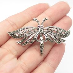 Great vintage condition.  925 Sterling Silver Vintage Real Ruby & Marcasite Gemstone Butterfly Pin Brooch  Weight: 8.9g   WELCOME TO PAWN SHOP We are an actual pawn shop and have been in business for over 25 years. Since 1990, our establishment has been serving a variety of clients by providing them with short term cash solutions and options of liquidity regarding their treasured heirlooms. Acknowledging that today′s customers are very sophisticated and are looking for a variety of investments, Vintage Silver Brooch With Gemstone, Vintage Silver Gemstone Brooch, Collectible Silver Gemstone Brooches, Silver Gemstone Brooch Collectible, Vintage Antique Silver Sterling Silver Brooches, Antique Sterling Silver Brooches For Gift, Butterfly Pin, Pawn Shop, Pin Brooch