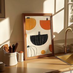 a kitchen counter with a framed painting on it