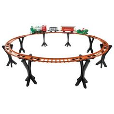 a toy train track with trees and cars on the tracks for children's play