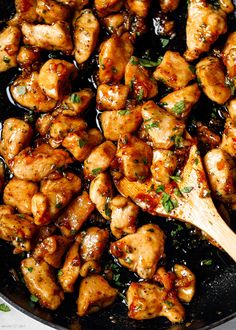 chicken with sauce and parsley in a skillet