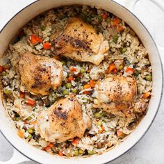 chicken and rice in a pot on a table