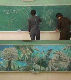 two boys standing in front of a chalkboard with trees on it and writing on the board