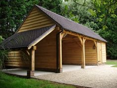 a large wooden building with a black roof