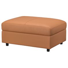 a tan leather ottoman sitting on top of a white floor