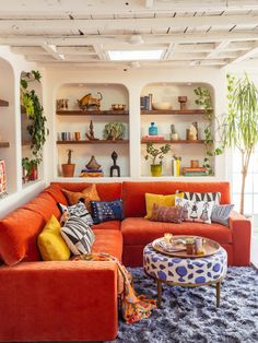 a living room filled with lots of furniture and decor