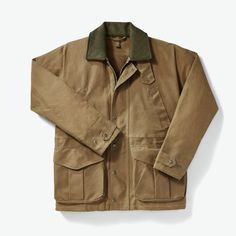 With a traditional boxy shape, and an incredibly functional design, Filson’s Tin Cloth Field Jacket is one of the brand’s most loved silhouettes. A waxed cotton outer shell provides essential protection from the elements, while a Mackinaw wool lined collar allows warmth and comfort. A rust-proof front zipper has been added along with aged brass hardware throughout, including on the snap fasteners which line the zipper, and provide protection to the pleated lower pockets. Chest hand warmer pocket Filson Mens, Safari Outfit, Tan Coat, Chore Coat, No Rain, Classic Jacket, Dark Tan, Brown Coat, Work Jackets