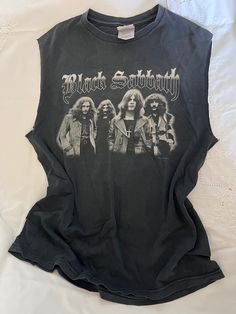 NFS 2000s Y2K Black Sabbath Rock 2004 Band Double Sided True Vtg Sleeveless Muscle Tee Shirt Size On Tag: M Modern Size: L Measurements in inches, laid flat: (Double for circumference) Pit to Pit: 20 Waist: 20 Hip/bottom edge: 20 Length shoulder to bottom: 27.5 Shoulder seam to shoulder seam: 17.5   Cotton All vintage items have been given estimated ages based on quality, materials, design and features of the pieces. These are estimates and not exact. All items are in wearable vintage condition, unless otherwise stated. We do our best to show any major issues like rips or discoloration in photos of the item. Measurements are taken by hand. Rock Band T Shirts Outfits, Black Sabbath Shirt, Band Shirt, Muscle Shirts, Y2k Black, Muscle Tee, Black Sabbath, Tshirt Outfits, Band Shirts