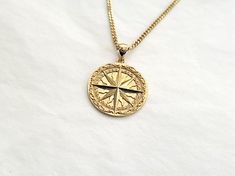 men's circle compass necklace pendant 1 made in 14k or 18k solid goldthis compass necklace pendant is inspired by classic compass.all features are so exquisite. you can see how it is described in detail with unaided eye.model wears a 2.1mm 60cm chain.the diameter of it is 24.0mm.14k gold compass necklace weightpendant only 5.33g (±7%)with a 1.7mm 42cm chain 9.10g (±7%)with a 2.1mm 42cm chain 11.03g (±7%)with a 2.4mm 42cm chain 13.08g (±7%)18k gold compass necklace weightpendant only 6.35g (±7%)w Luxury Gold Necklace With Compass Design, Timeless Medallion Jewelry With Compass Design, Luxury Compass Medallion Jewelry, Luxury Compass Design Medallion Jewelry, 14k Gold Compass Design Round Jewelry, Gold Medallion Jewelry With Compass Design, Luxury Round Pendant Necklace With Compass Design, Luxury Compass Design Round Pendant Necklace, Timeless Round Compass Design Jewelry