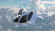 a futuristic flying vehicle in the sky above clouds