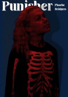 a woman with long hair wearing a skeleton t - shirt in front of a blue background