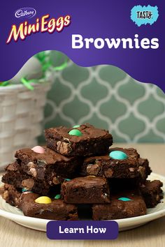 brownies are stacked on top of each other in front of a white bowl with easter eggs