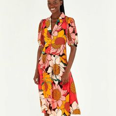 Give Yourself Some Bold Flowers! The Colorful Sunflowers Midi Dress Is So Fresh That You’ll Want To Wear It On Repeat. It Features A Cozy Fit With A Standout Neckline And Brings One Of Our Must-Have Prints Of The Season. Have You Noticed The Sunflower-Shaped Buttons? It’s So Mind-Blowing! Multicolor Floral Print Knee-length Midi Dress, Multicolor Knee-length Midi Dress With Floral Print, Vibrant Multicolor Print Midi Dress For Spring, Vibrant Multicolor Floral Print Dresses, Vibrant Knee-length Spring Dresses, Chic Short Sleeve Midi Dress With Vibrant Print, Orange Short Sleeve Midi Dress For Garden Party, Retro V-neck Midi Dress With Floral Print, Multicolor Floral Print Midi Dress