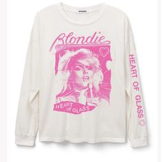 A Bold Move By Blondie, Some Commotion Please For The Group’s Disco-Tinged Pop Hit “Heart Of Glass.” Acclaimed As One Of The Band’s Signature Songs And A Defining Chart Topper Of The New Wave Era, This Bright And Bold Ringer Tee Features A Scanned Portrait Of Frontwoman Debbie Harry And An Iconic Graphic Of The Heart-Shaped Glass Motif Synonymous With The Lead Single. Snatch This As A Tribute To The Track Harry Herself Stated Was The Hit She Was Proudest Of Having Written. The Specs Made From A Blondie Heart Of Glass, Clothes Print, Merch Tee, Team Green, Music Merch, Ladder Stitch, Debbie Harry, The New Wave, Graphic Tees Vintage