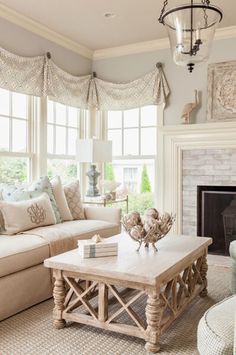 a living room filled with furniture and a fire place