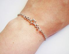 triple Star bracelet in silver by RobertaValle Nickel-free Silver Star Bracelet, Dainty Silver Star Bracelets, Silver Star-shaped Adjustable Chain Bracelet, Adjustable Silver Star-shaped Chain Bracelet, Silver Adjustable Chain Bracelet With Star Charm, Adjustable Silver Chain Bracelet With Star Charm, Dainty Silver Star-shaped Chain Bracelet, Silver Star Bracelet, Stars Bracelet