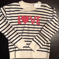 Cute Cream Colored, Soft-Knit Sweater With Navy Stripes And Pink Lettering Across The Chest. The Letters Have A Sparkle To Them. Gap Striped Sweater, Walmart Heart Sweater, Trendy Valentine's Day Sweater With Heart Print, Pink Heart Print Sweater For Valentine's Day, Pink Heart-shaped Valentine's Day Sweater, Letter Sweatshirt, Navy Stripes, Blue Cream, Soft Knits