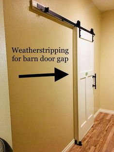 a sign that says weatherstriping for barn door gap and an arrow pointing to the right