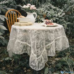 the table is covered with white lace