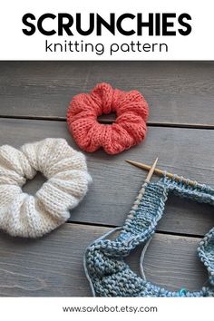 three crocheted scrunches sitting on top of a wooden table next to yarn