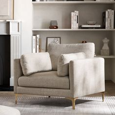 a living room filled with furniture and bookshelves next to a fire place in front of a fireplace