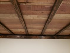 the ceiling is made of wood and has exposed beams