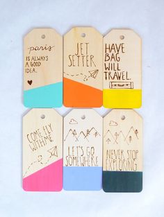 wooden luggage tags with writing on them