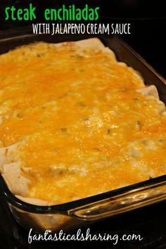 an enchiladas in a glass baking dish on top of a stovetop