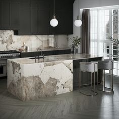 a kitchen with marble counter tops and black cabinets, along with two stools in front of the island