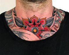 a man with a tattoo on his neck has an orange and black flower in the center