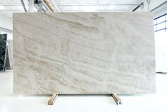 a large white marble slab in a warehouse