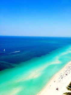 an aerial view of the beach and ocean