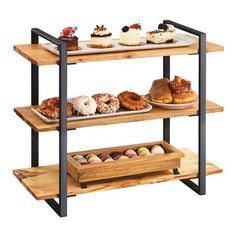 three tiered wooden tray with pastries on it