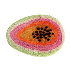 a colorful rug with an orange, pink and green design on the bottom that has black dots in it