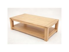 a wooden coffee table sitting on top of a white floor