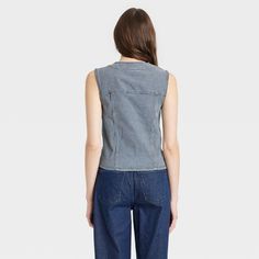 This Button-Front Denim Vest from Universal Thread™ will make a cool addition to your denim collection. Made from midweight cotton fabric with added stretch in a regular fit, it offers comfortable all-day wear. The flattering V-neckline, button-front design and chest flap pockets add touches of classic style. You can wear this sleeveless denim vest with high-waist pants, skirts and more for a variety of chic ensembles. Universal Thread™: Found exclusively at Target. Denim Blue Cotton Vest With Buttons, Spring Cotton Denim Vest With Snap Buttons, Casual Cotton Denim Vest With Buttons, Spring Cotton Denim Vest With Button Closure, Spring Casual Denim Vest With Snap Buttons, Casual Denim Vest With Snap Buttons For Spring, Casual Spring Denim Vest With Snap Buttons, Casual Stretch Denim Vest In Cotton, Casual Stretch Cotton Denim Vest