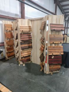 several pieces of wood stacked on top of each other in a room with tables and chairs