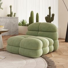 a living room filled with furniture next to a tall cactus plant on the floor and a round rug