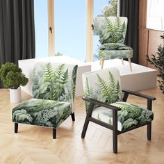 two chairs with green leaves on them sit in front of a window, near a potted plant