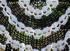 white crocheted doily hanging from a net