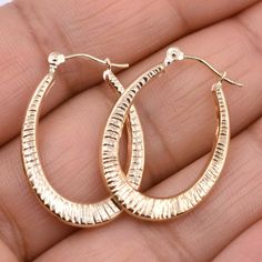 "1\" Textured Oval Hoop Earrings Real 14K Yellow Gold * Metal : Real 14K Yellow Gold (Properly Stamped, 14K) * Condition : Brand New * Finish : Polished * Avg Weight : 1.22 grams * Length : 26mm = 1\" * Width : 18.7mm = 3/4\" * Clasp/Bail : Hinged All of our items are brand new and are shipped with a gift box." Earrings Real, Oval Hoop Earrings, Gold Price, Jewelry Earrings Hoops, Chain Link Necklace, Real Gold, Gold Metal, Chain Necklace, Gift Box