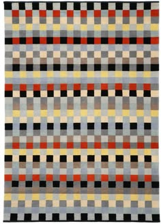 a multicolored rug with squares and lines on the bottom, in various colors