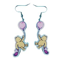 a pair of earrings with an image of a teddy bear holding a balloon