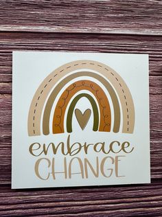 a sticker that says embrace change with an image of a rainbow in the background